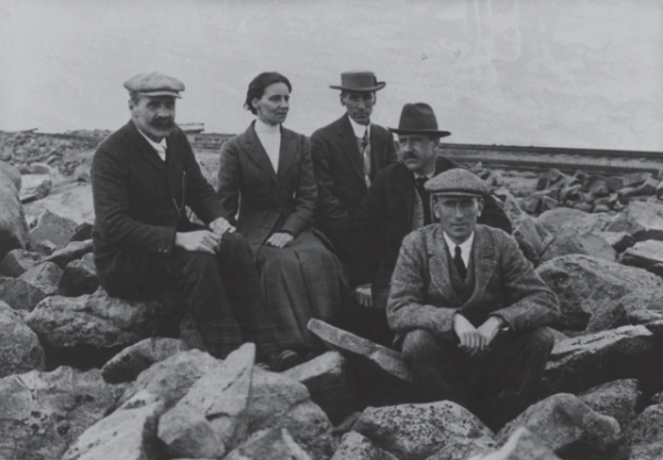 Mabel Fitzgerald as part of a group of five people, sat in a boulder field