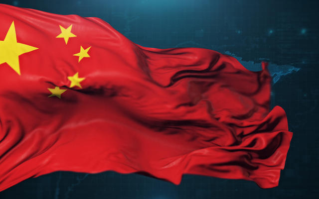 Chinese flag against a dark background