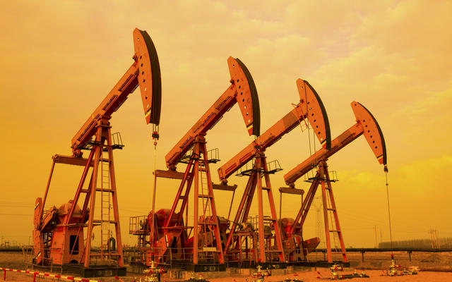 Oil Pumps depicted against a sunset sky