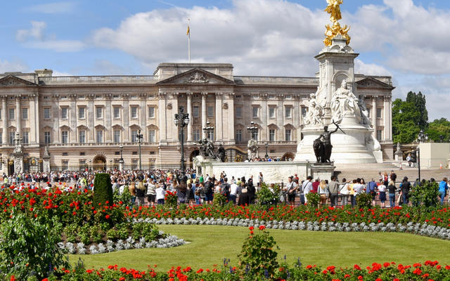 Buckingham Palace - with flower beds and the Queen Victoria Memorial in the foreground