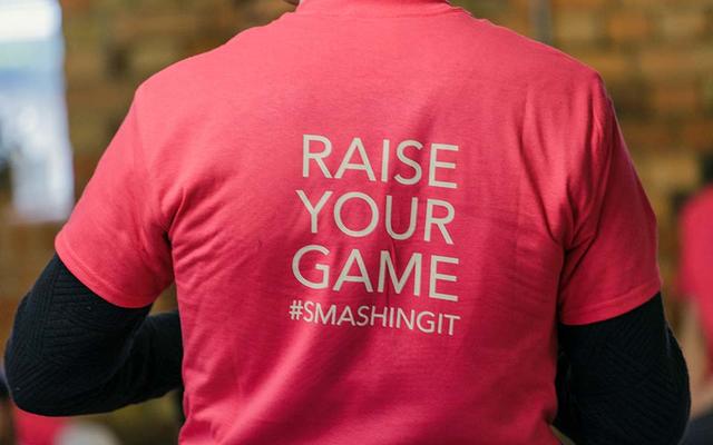 The back of an Oxford Foundry t-shirt, which reads 'Raise your game #smashingit'