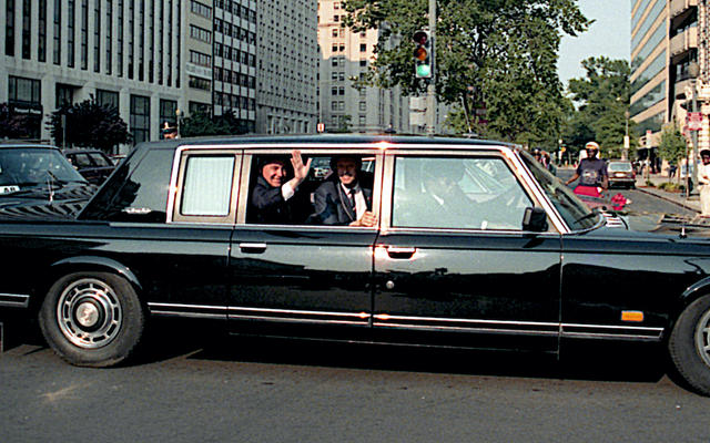 Russian President Mikhail Gorbachev waves from his limousine. Washington DC, USA. 31st May, 1990