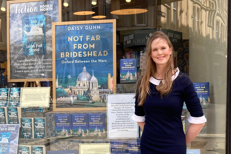 Daisy Dunn with her book outside a shop
