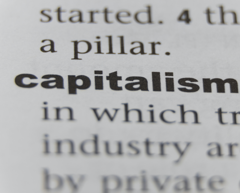 A close-up picture of the word 'capitalism' in a dictionary