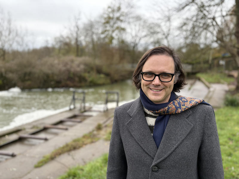 Dr Kevin Grecksch stands by the River Cherwell on 27 November 2025