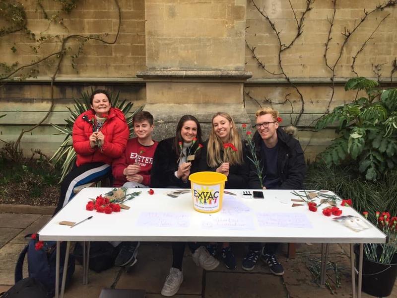 Five Exeter College students sat behind a table, selling roses to raise money
