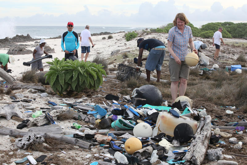 Volunteers working to clear up plastic and other debris on a beach