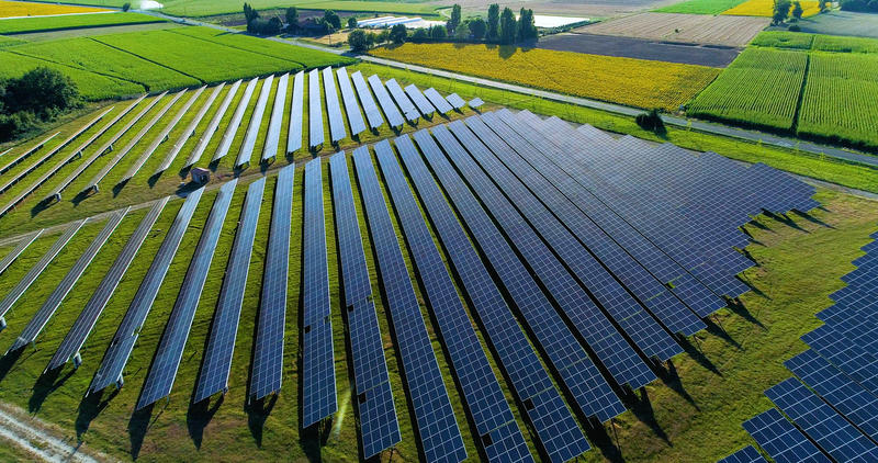 An aerial view of a field of solar panels