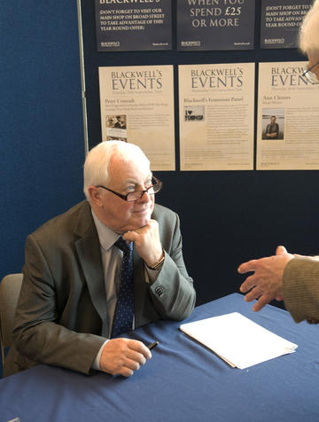 Lord Patten signing books for alumni at Meeting Minds 2013