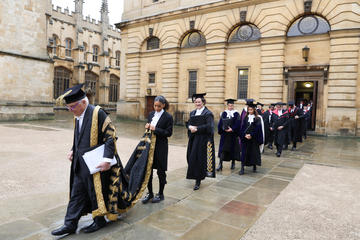 Oxford Chancellor Lord Patten of Barnes leads the procession out of the Sheldonian Theatre