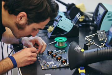 Brill Power employee works on a battery module